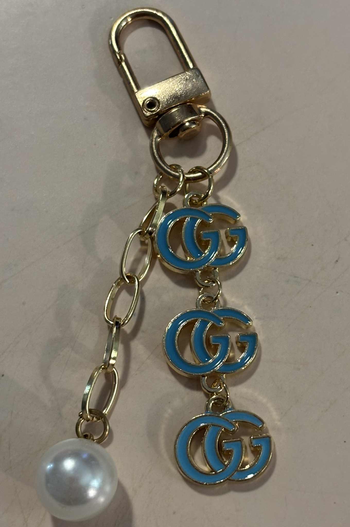 Bag charm G pearl teal 3"