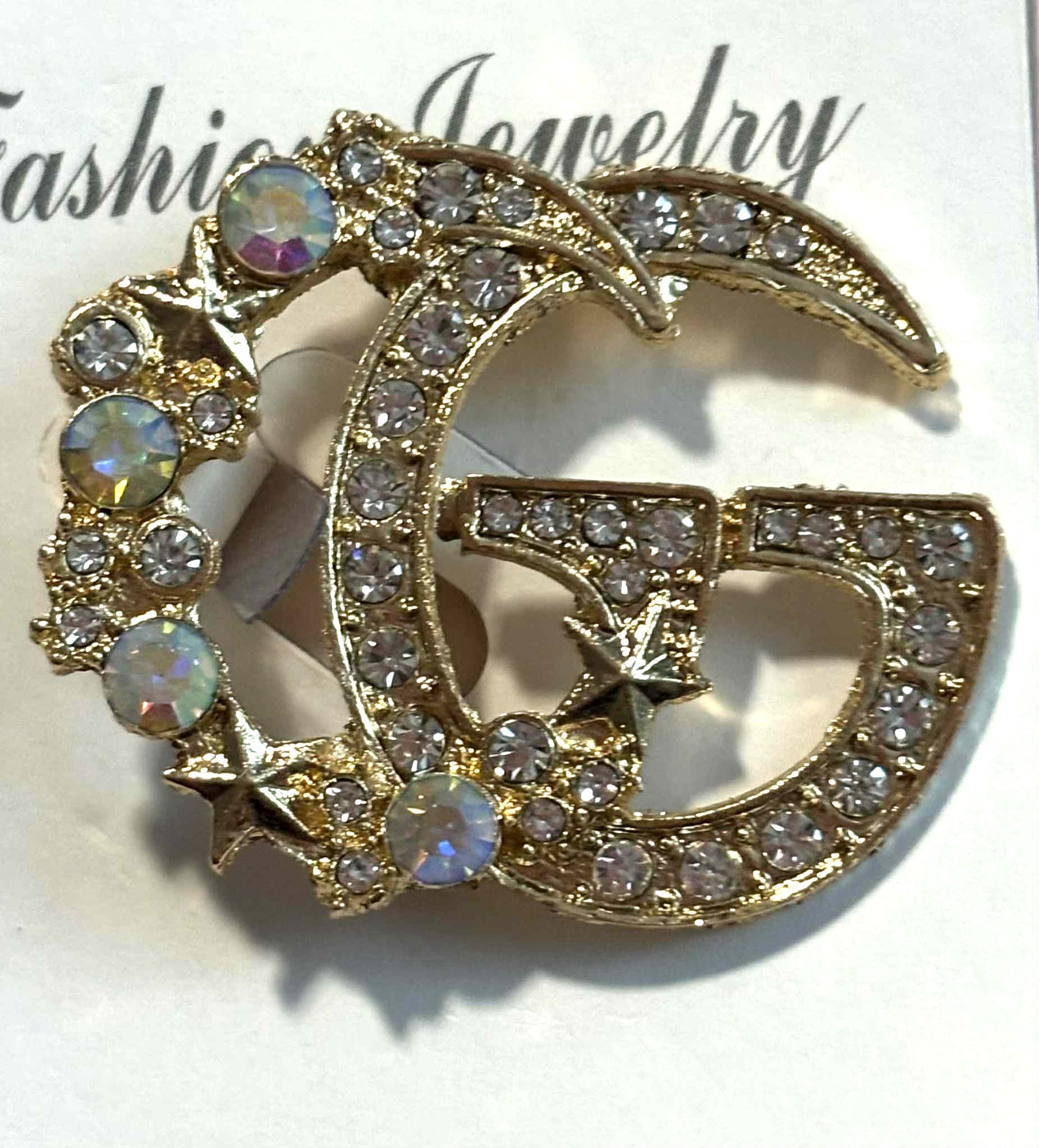 Broach G with stars gold