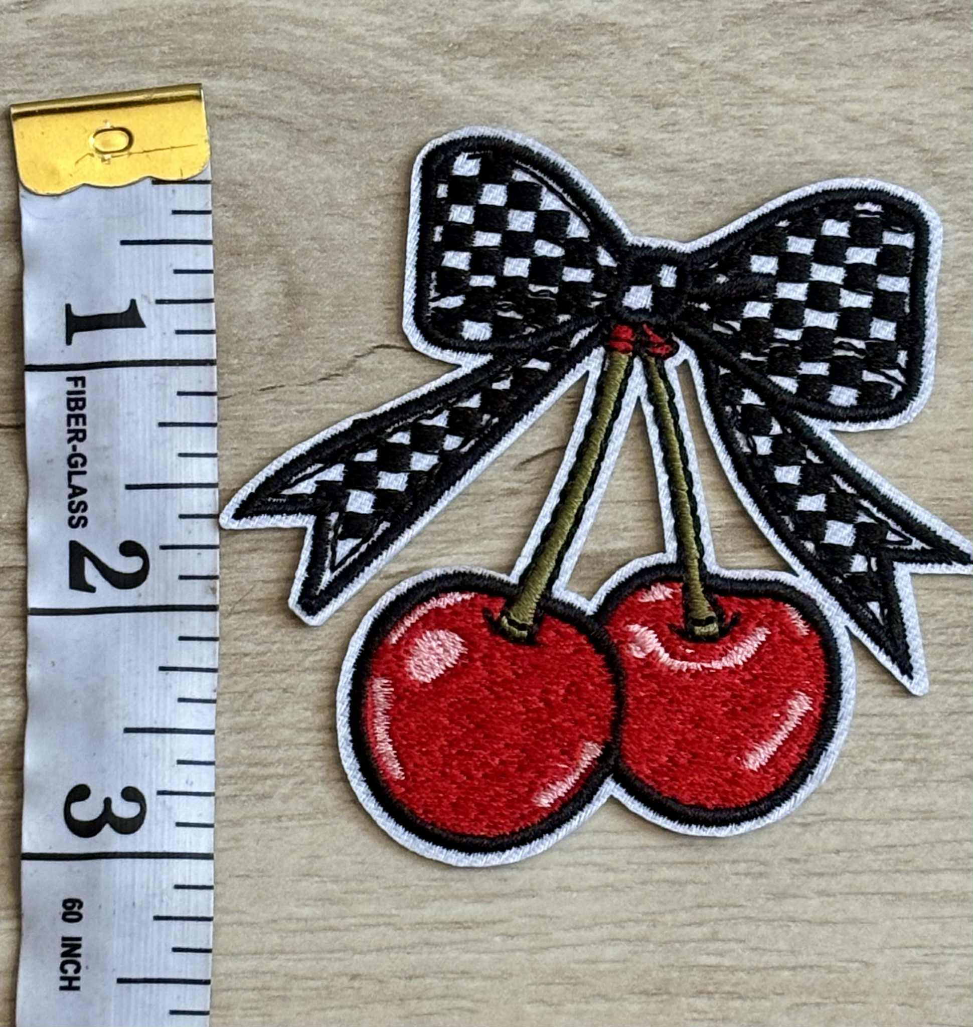 Patch plaid bow with cherries